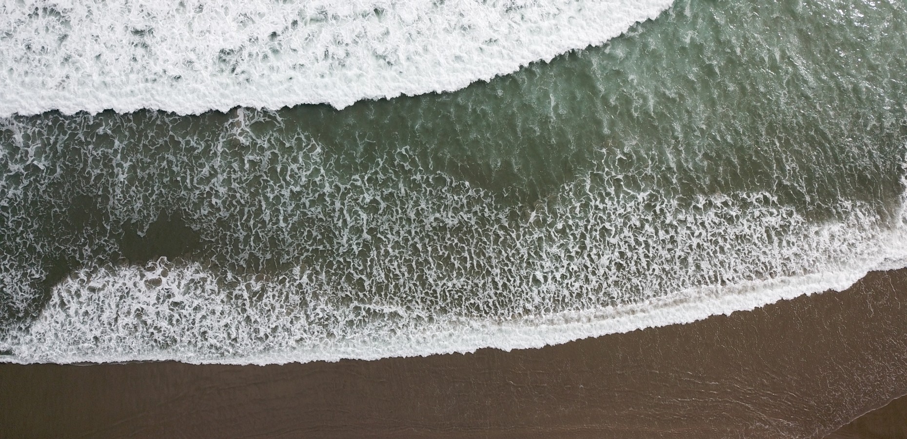 Waves on a black sand beach