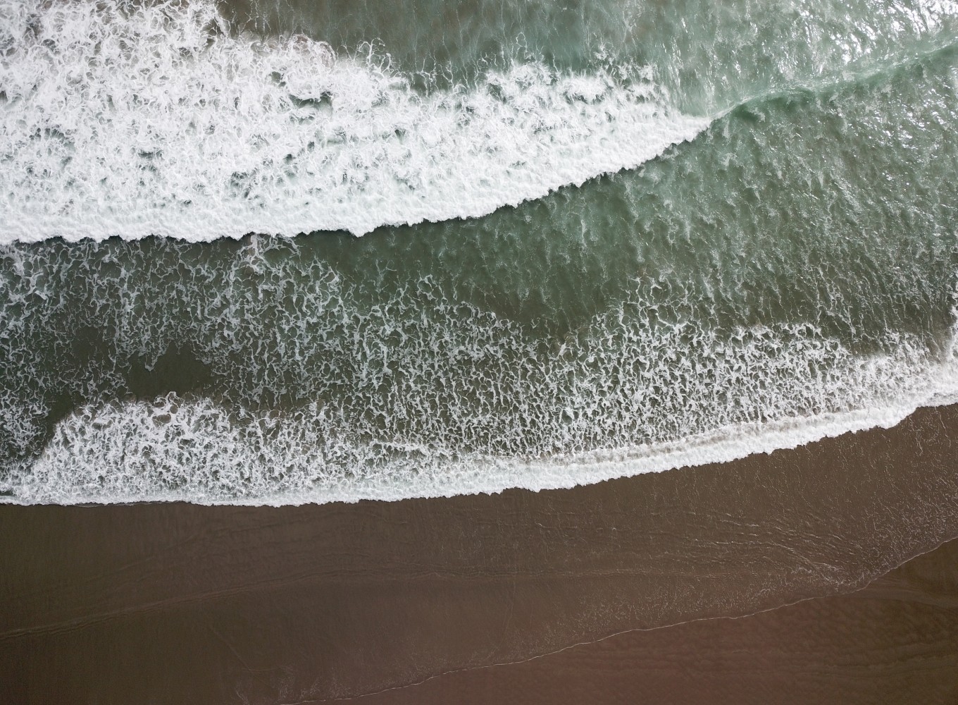 Waves on a black sand beach