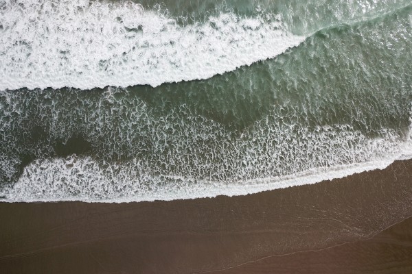 Waves on a black sand beach